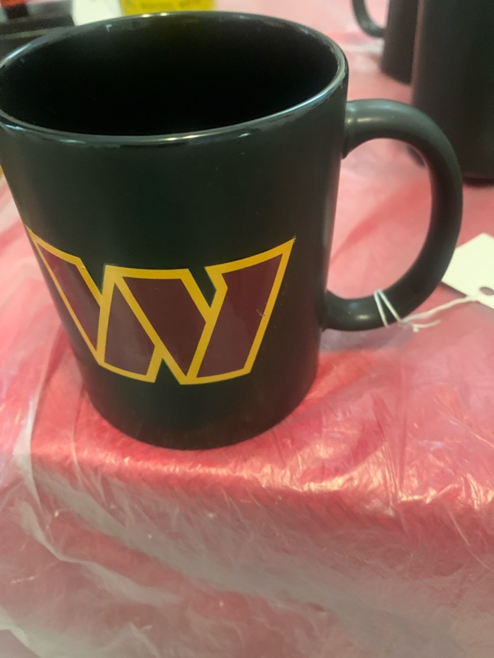 Black Ceramic Coffee Mug with Yellow-Outlined Maroon Emblem